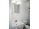 Bright bathroom featuring a modern sink vanity, and an illuminated mirror above a modern toilet at 12236 Fairlawn Dr, Riverview, FL 33579