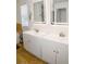 Bathroom featuring modern cabinets, double sinks, and stainless steel fixtures at 12236 Fairlawn Dr, Riverview, FL 33579
