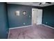 Spacious bedroom with gray painted walls and wall art, creating a serene and inviting atmosphere at 12236 Fairlawn Dr, Riverview, FL 33579