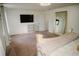 Spacious bedroom with neutral carpet and natural light from large windows at 12236 Fairlawn Dr, Riverview, FL 33579