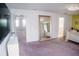 Bedroom featuring neutral carpet, a large mirror, and an adjacent room at 12236 Fairlawn Dr, Riverview, FL 33579