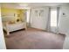 Spacious bedroom features neutral carpet, decorative headboard, and natural light at 12236 Fairlawn Dr, Riverview, FL 33579