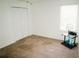 Bright bedroom features a closet, a sunny window, plush carpeting, and a stylish side table at 12236 Fairlawn Dr, Riverview, FL 33579