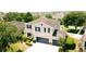 Beautiful two-story home boasts a well-manicured lawn and mature trees, enhancing its curb appeal at 12236 Fairlawn Dr, Riverview, FL 33579