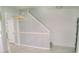 Inviting foyer with stylish lighting, patterned wallpaper, and a view of the staircase at 12236 Fairlawn Dr, Riverview, FL 33579