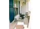Cozy front porch with a seating area that invites relaxation and adds charm to the entrance of this well-maintained home at 12236 Fairlawn Dr, Riverview, FL 33579