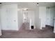 Bright hallway with neutral carpet, leading to multiple rooms with staircase access at 12236 Fairlawn Dr, Riverview, FL 33579