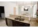 Open concept kitchen with granite counters, stainless appliances, and wood cabinets at 12236 Fairlawn Dr, Riverview, FL 33579