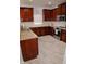 Gourmet kitchen featuring wood cabinets and stainless appliances at 12236 Fairlawn Dr, Riverview, FL 33579