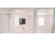 Bright living room with white walls, marble flooring, and ample natural light, ready for personalization and comfort at 12236 Fairlawn Dr, Riverview, FL 33579