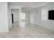 Bright, open-concept living room features marble floors and neutral tones for a clean and modern feel at 12236 Fairlawn Dr, Riverview, FL 33579