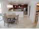 Open concept living space with modern kitchen, dining area, and living room at 12236 Fairlawn Dr, Riverview, FL 33579