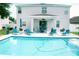Gorgeous backyard features a pool and deck area with lounge chairs, perfect for relaxation and entertaining at 12236 Fairlawn Dr, Riverview, FL 33579