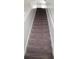 Carpeted staircase featuring neutral tones and white trim leads to the upper level of the home at 12236 Fairlawn Dr, Riverview, FL 33579
