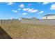 Large fenced backyard with potential for landscaping, gardening, or recreational use in a serene setting at 16750 Sunburst Lake St, Wimauma, FL 33598