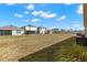 Expansive backyard with a well-maintained lawn, perfect for outdoor activities and entertaining at 16750 Sunburst Lake St, Wimauma, FL 33598