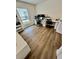 Functional home office with a large desk, dual monitors, stylish seating, and a built-in bookshelf at 16750 Sunburst Lake St, Wimauma, FL 33598