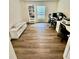 Inviting home office with modern desk setup, shelving, and ample natural light at 16750 Sunburst Lake St, Wimauma, FL 33598