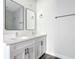 Bathroom with double sinks and modern fixtures at 18392 Poston Ave, Port Charlotte, FL 33948