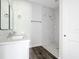 Bathroom with marble tile and a sleek vanity at 18392 Poston Ave, Port Charlotte, FL 33948