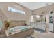 Bathroom showcasing a large soaking tub and dual sink vanity at 5497 56Th E Ct, Bradenton, FL 34203
