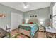 Bedroom featuring a flamingo theme, ceiling fan, and generous closet space at 5497 56Th E Ct, Bradenton, FL 34203