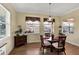 Cozy breakfast nook filled with natural light, featuring a round table and comfortable wicker chairs at 5497 56Th E Ct, Bradenton, FL 34203
