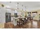 Open kitchen with a central island and breakfast nook featuring modern appliances and ample countertop space at 5497 56Th E Ct, Bradenton, FL 34203