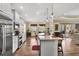 Spacious kitchen with stainless steel appliances, a central island, and a breakfast nook overlooking the backyard at 5497 56Th E Ct, Bradenton, FL 34203