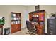 Office featuring a wooden desk, bookcase, and a file cabinet at 5497 56Th E Ct, Bradenton, FL 34203