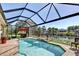 Gorgeous pool featuring screened enclosure, fountain, and lovely water views at 5497 56Th E Ct, Bradenton, FL 34203