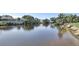 Expansive waterfront view featuring a tranquil canal, private docks, and lush landscaping, perfect for boating enthusiasts at 5497 56Th E Ct, Bradenton, FL 34203