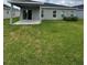 Image shows the backyard of the property, focusing on the lawn and outdoor space at 17130 11Th Ter E, Bradenton, FL 34212