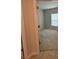 A bedroom with beige walls and carpet, and a window with blinds at 17130 11Th Ter E, Bradenton, FL 34212