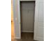 A walk-in closet with beige walls and carpet, and a white wire rack at 17130 11Th Ter E, Bradenton, FL 34212