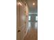 Hallway with neutral walls, tile floors, and doors leading to rooms, with windows providing natural light at 17130 11Th Ter E, Bradenton, FL 34212