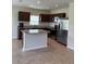 Well-equipped kitchen featuring stainless steel appliances, granite countertops, and a functional island at 17130 11Th Ter E, Bradenton, FL 34212