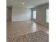 Large, sunlit living room with neutral paint, tile floors, and multiple windows at 17130 11Th Ter E, Bradenton, FL 34212