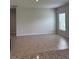 Spacious living area with neutral paint, tile floors, and a bright window at 17130 11Th Ter E, Bradenton, FL 34212