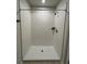 Bathroom shower with a glass door and white tile at 17130 11Th Ter E, Bradenton, FL 34212
