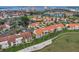 Breathtaking aerial view of a waterfront community with stunning terra cotta roofs and lush greenery at 6151 Bahia Del Mar Blvd # 125, St Petersburg, FL 33715