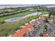 Stunning aerial view showcasing the condo's prime location near a golf course and scenic lakes at 6151 Bahia Del Mar Blvd # 125, St Petersburg, FL 33715