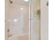 Bathroom featuring a shower with glass door and tiled walls at 6151 Bahia Del Mar Blvd # 125, St Petersburg, FL 33715