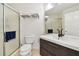 Well-lit bathroom featuring a walk-in shower, toilet, and vanity with modern fixtures at 6151 Bahia Del Mar Blvd # 125, St Petersburg, FL 33715