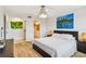Bedroom with a bed, ceiling fan, and access to the bathroom at 6151 Bahia Del Mar Blvd # 125, St Petersburg, FL 33715