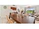 Bright dining area with patio views, tile floor, modern furniture, and beachy decor at 6151 Bahia Del Mar Blvd # 125, St Petersburg, FL 33715
