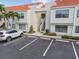 Charming condo with a terra cotta roof, ample parking, and tropical landscaping at 6151 Bahia Del Mar Blvd # 125, St Petersburg, FL 33715