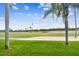 Picturesque golf course view with lush green fairways and palm trees under a blue sky at 6151 Bahia Del Mar Blvd # 125, St Petersburg, FL 33715