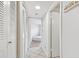 Hallway leading to a bedroom with closet space at 6151 Bahia Del Mar Blvd # 125, St Petersburg, FL 33715