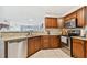 Well-equipped kitchen with stainless steel appliances and warm wood cabinetry at 6151 Bahia Del Mar Blvd # 125, St Petersburg, FL 33715